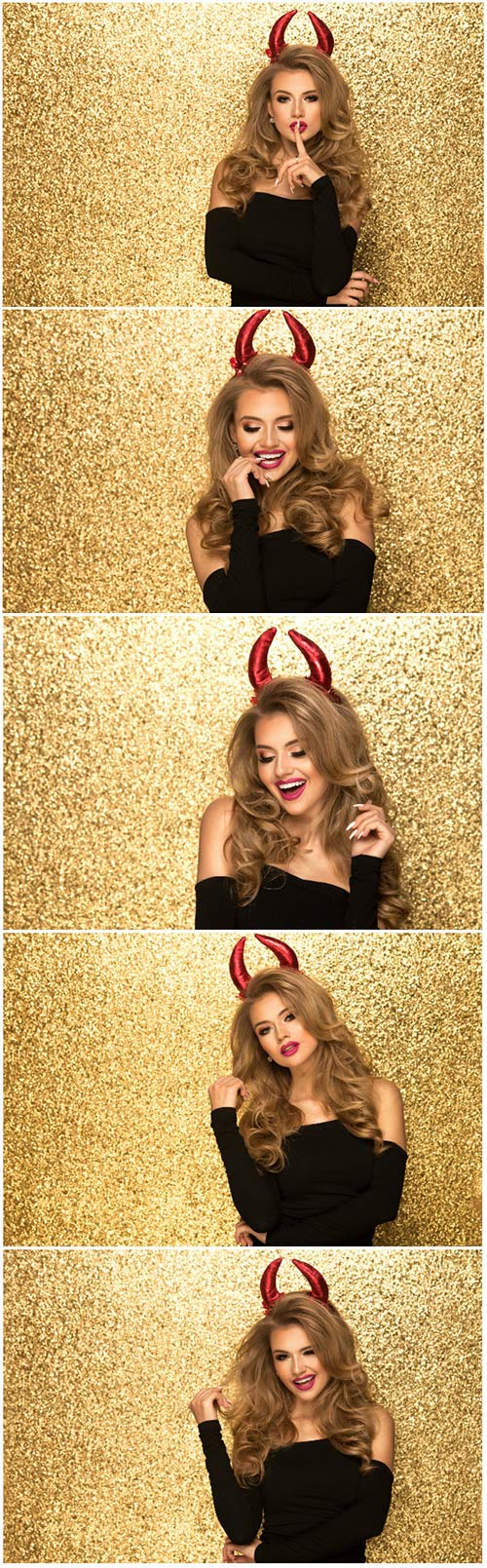 Girl with red horns on gold background stock photo